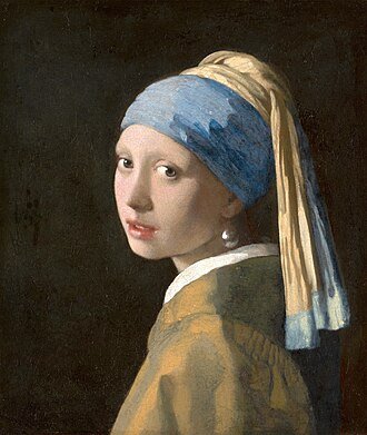 Girl with a Pearl Earring by Johannes Vermeer, highlighting soft light and detail.